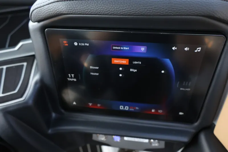 Slide: The Image of The image shows a modern control display of a Tigé Z3 boat with various control options. - 43