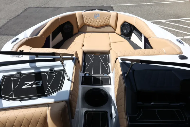 Slide: The Image of The image shows the interior of a 2027 Tigé Z3 boat with sleek, upholstered seating. - 24