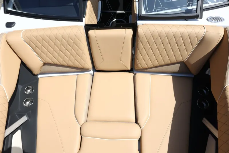 Slide: The Image of The image shows the luxurious beige upholstered seating area of a Tigé Z3 boat. - 31