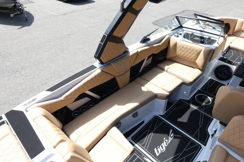 Slide: The Image of The image shows the interior of a 2027 Tigé Z3 boat with beige upholstery and modern design. - 19