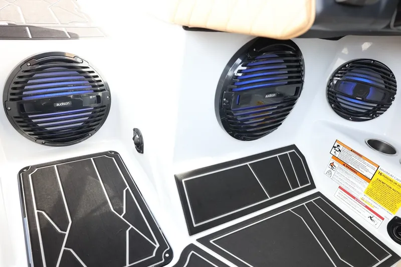 Slide: The Image of The image shows the interior of a Tigé Z3 boat with modern speakers and stylish flooring. - 50