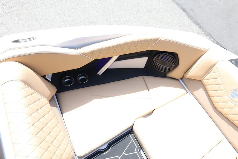 Slide: The Image of The image shows the bow area of a Tigé Z3 boat with beige upholstery and speakers. - 25
