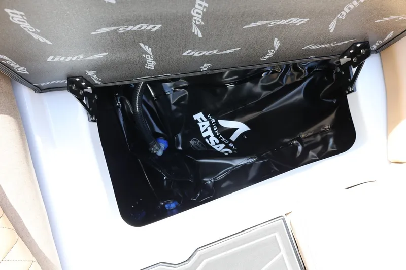 Slide: The Image of A storage compartment in the boat with a black FatSac water tank. - 28