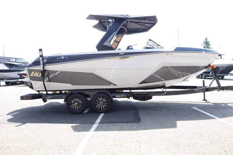 Slide: The Image of 2027 Tigé Z3 with sleek design and tower, parked on a trailer outdoors. - 9
