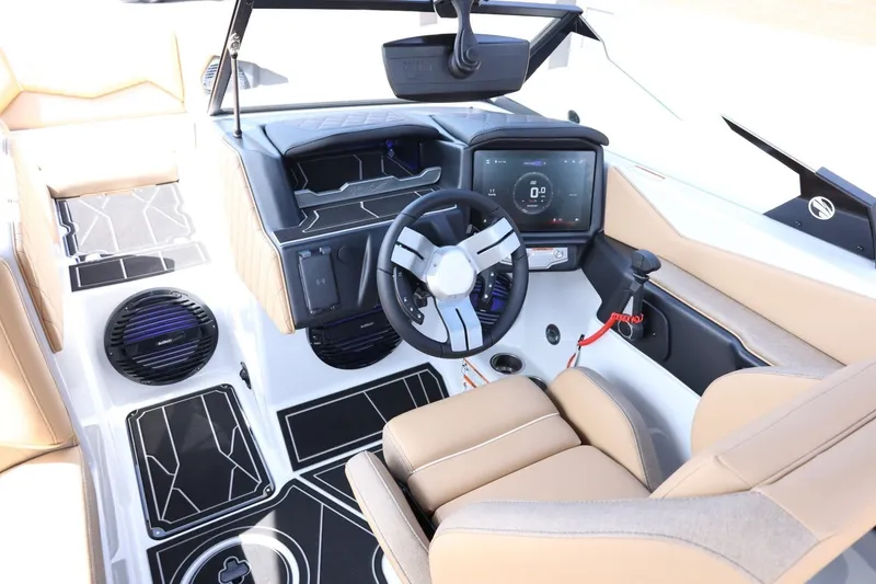 Slide: The Image of The cockpit of a modern boat with a sleek steering wheel and large digital display. - 22