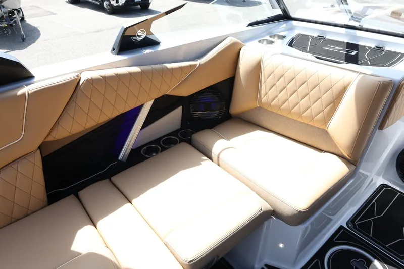 Slide: The Image of Luxurious seating area with brown upholstery and quilted design in a modern boat. - 21