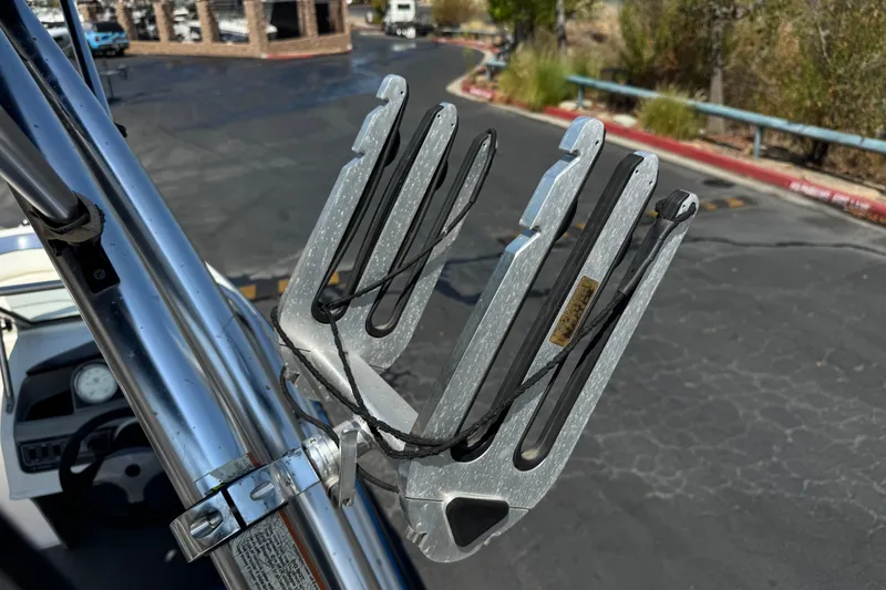 Slide: The Image of Wakeboard rack on a 2012 Bayliner 195 Bowrider, parked on asphalt. - 14