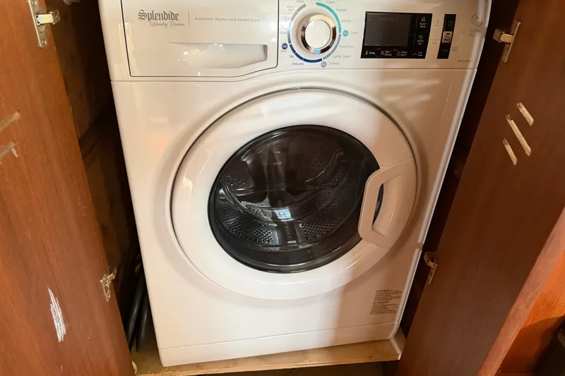 Slide: The Image of Splendide washer-dryer in wooden cabinet on Hunter Passage 450, 1994 model. - 14