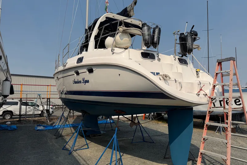 The Image of Hunter Passage 450 sailboat from 1994 on stands in a boatyard. - 0