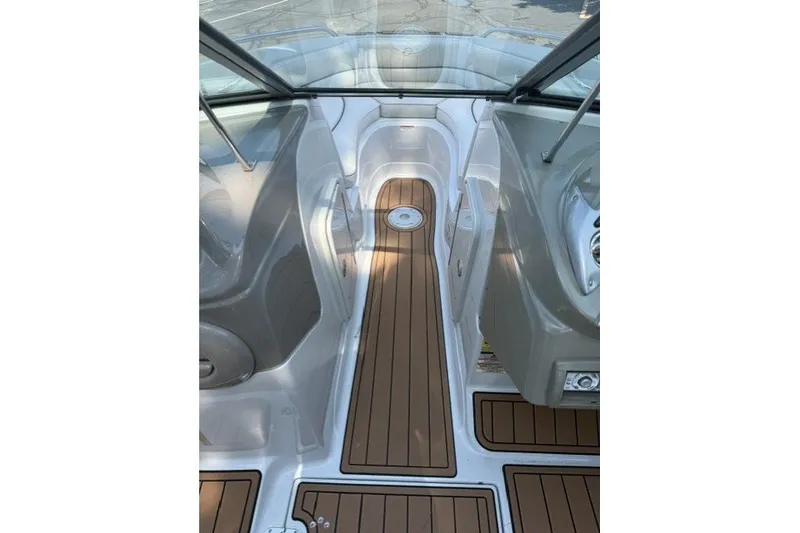 Slide: The Image of 2008 Crownline 200 LS boat interior with sleek wood flooring and modern design. - 14