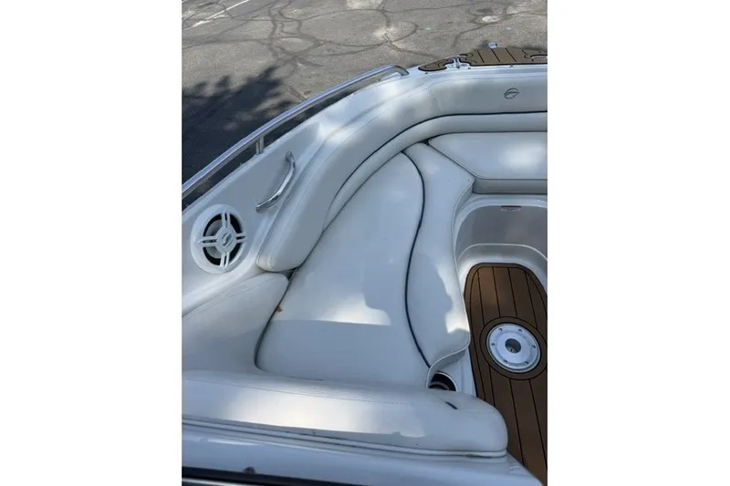 Slide: The Image of 2008 Crownline 200 LS boat interior with white seating and wood accents. - 16