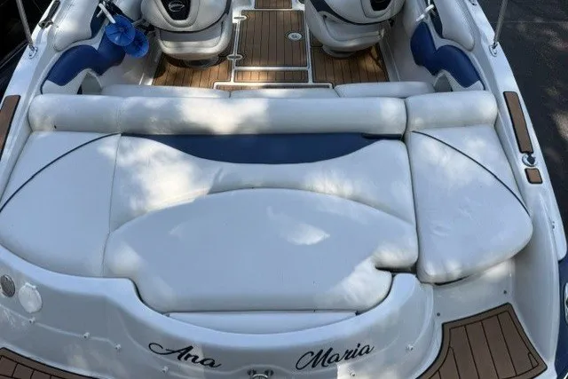 Slide: The Image of 2008 Crownline 200 LS boat interior with white seating and wood accents. - 6