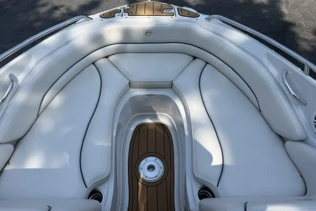 Slide: The Image of 2008 Crownline 200 LS boat interior with white seating and wood accents. - 15