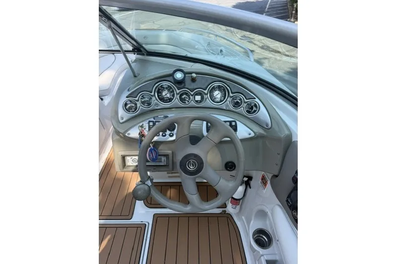 Slide: The Image of 2008 Crownline 200 LS boat dashboard with steering wheel and instrument panel. - 11