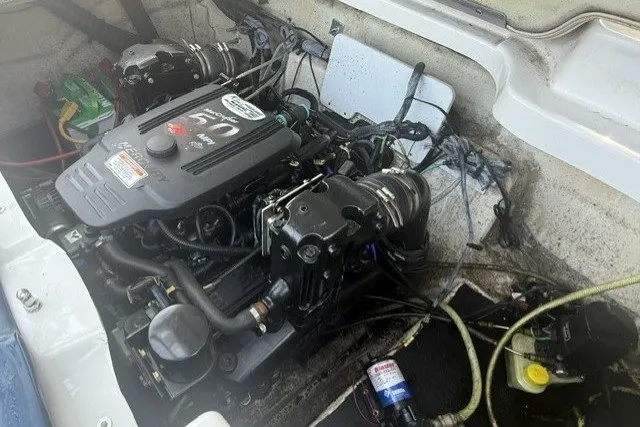 Slide: The Image of Engine compartment of a 2008 Crownline 200 LS boat, showcasing detailed mechanical components. - 20