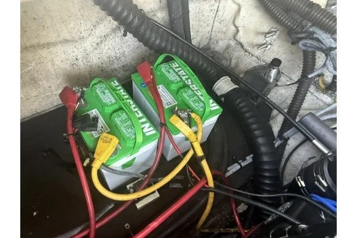 Slide: The Image of Dual Interstate batteries in a 2008 Crownline 200 LS boat engine compartment. - 22