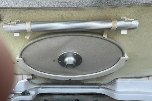 Slide: The Image of 2008 Crownline 200 LS boat interior detail with mounted table and support pole. - 18