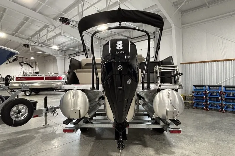 Slide: The Image of 2027 Premier 220 Sunscape RL - CL pontoon boat with powerful V6 engine in showroom. - 5