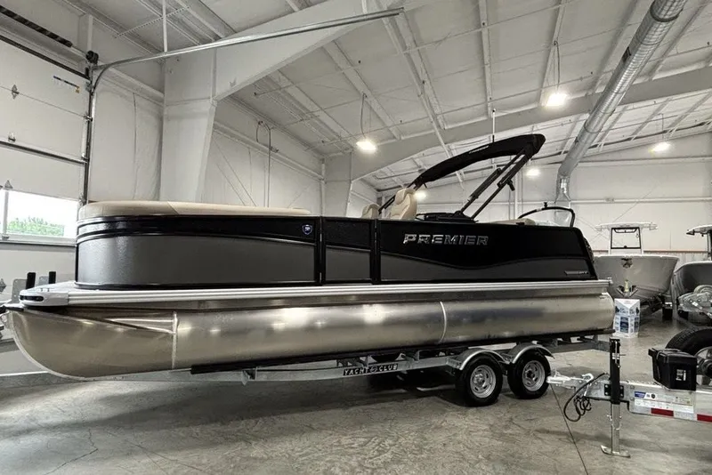 The Image of 2027 Premier 220 Sunscape RL - CL pontoon boat in a showroom on a trailer. - 1
