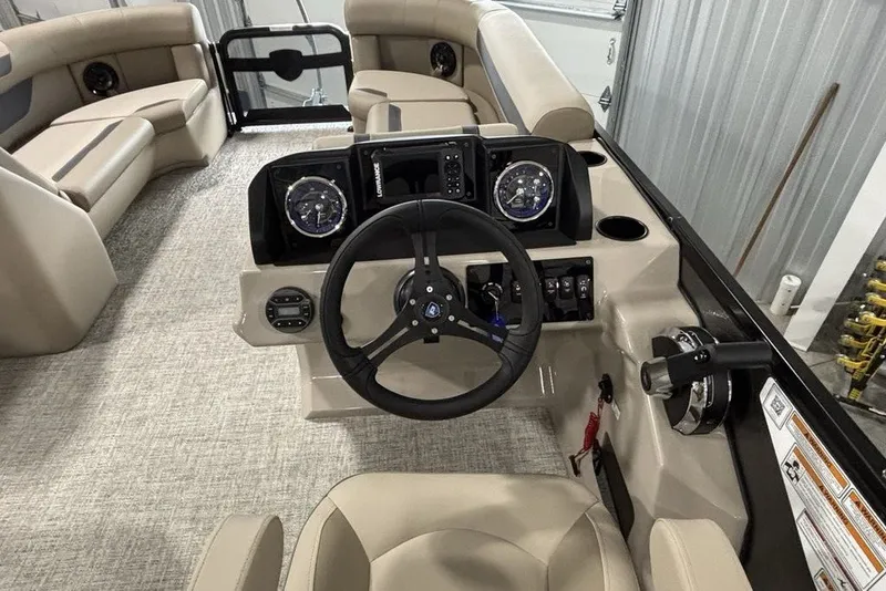 Slide: The Image of 2027 Premier 220 Sunscape RL - CL boat interior with steering wheel and seating. - 25
