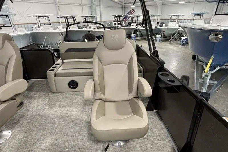 Slide: The Image of 2027 Premier 220 Sunscape RL - CL boat interior with beige seating and cup holders. - 14