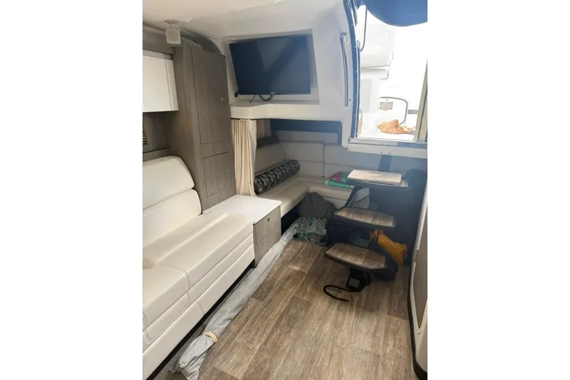 Slide: The Image of Interior of 2021 Monterey 355 Sport Yacht with modern seating and wooden flooring. - 25