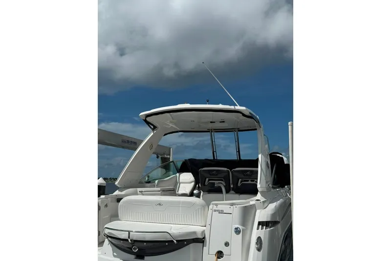Slide: The Image of 2021 Monterey 355 Sport Yacht with sleek design under cloudy sky. - 13