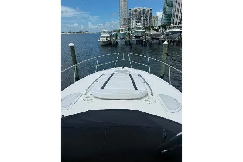Slide: The Image of 2021 Monterey 355 Sport Yacht docked at marina with city skyline backdrop. - 23