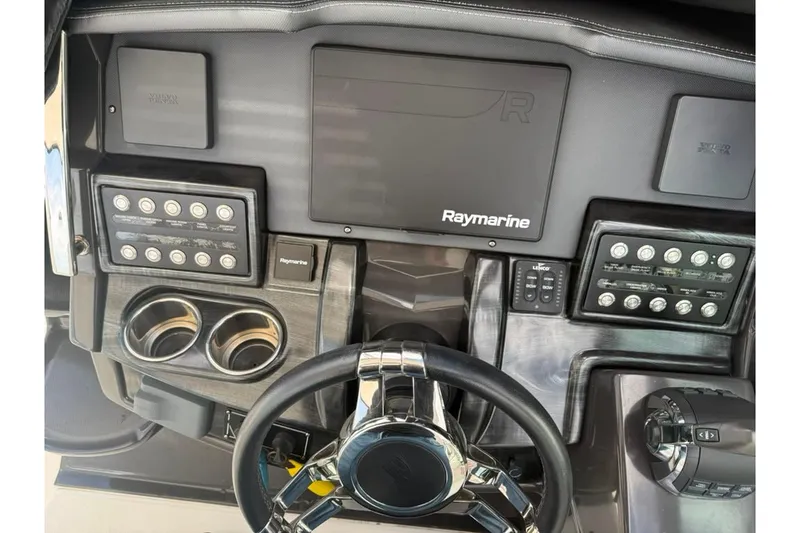 Slide: The Image of Dashboard of 2021 Monterey 355 Sport Yacht with Raymarine navigation system and controls. - 24