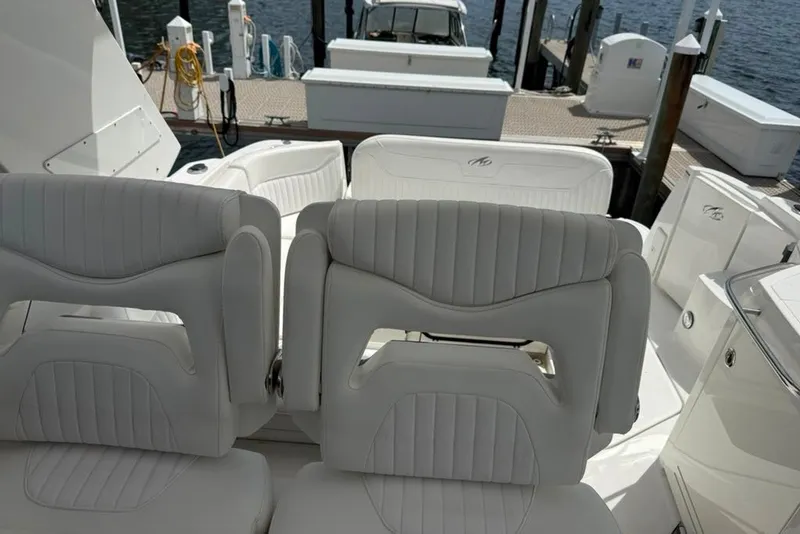 Slide: The Image of Luxury seating on a 2021 Monterey 355 Sport Yacht at a marina dock. - 22