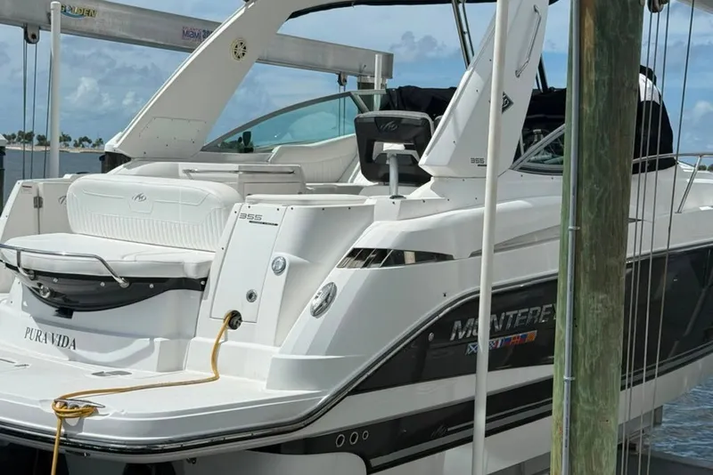 Slide: The Image of 2021 Monterey 355 Sport Yacht docked, showcasing sleek design and luxury features. - 15