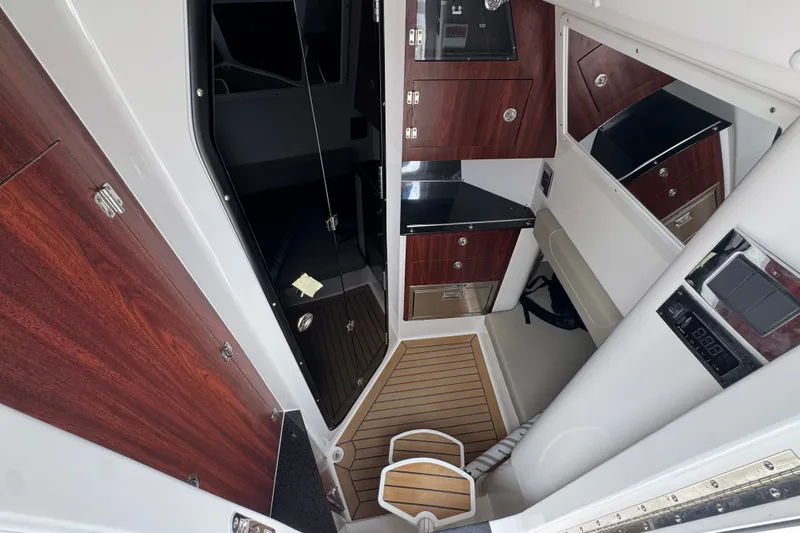 Slide: The Image of Luxurious interior of 2027 Caymas 401 DR boat with wood accents and modern amenities. - 30
