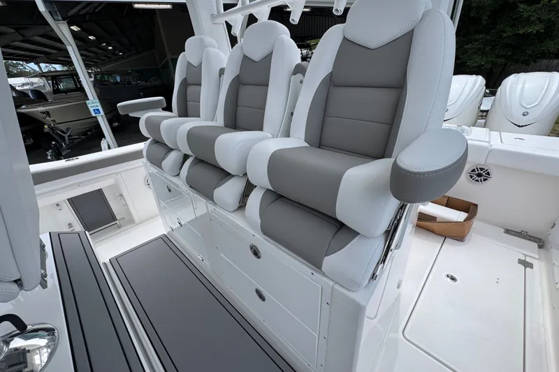 Slide: The Image of Luxury seating on 2027 Caymas 401 DR boat, featuring plush gray and white upholstery. - 46