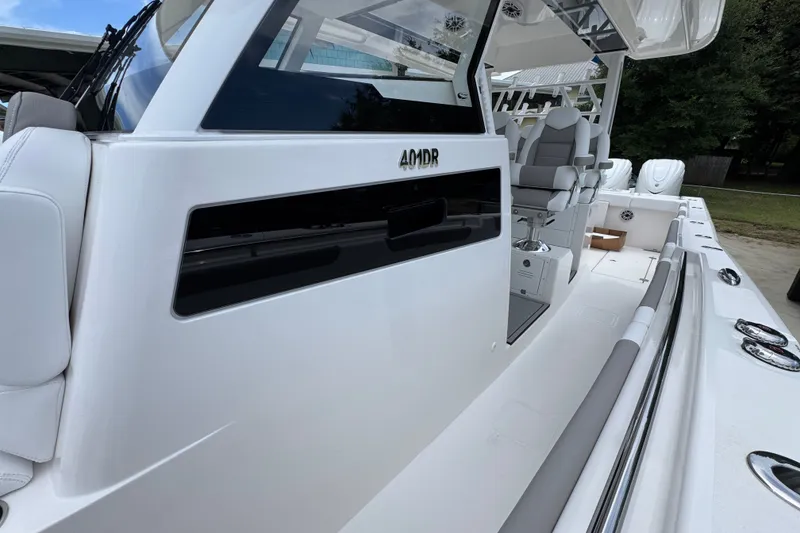 Slide: The Image of 2027 Caymas 401 DR boat interior with sleek seating and modern design. - 28