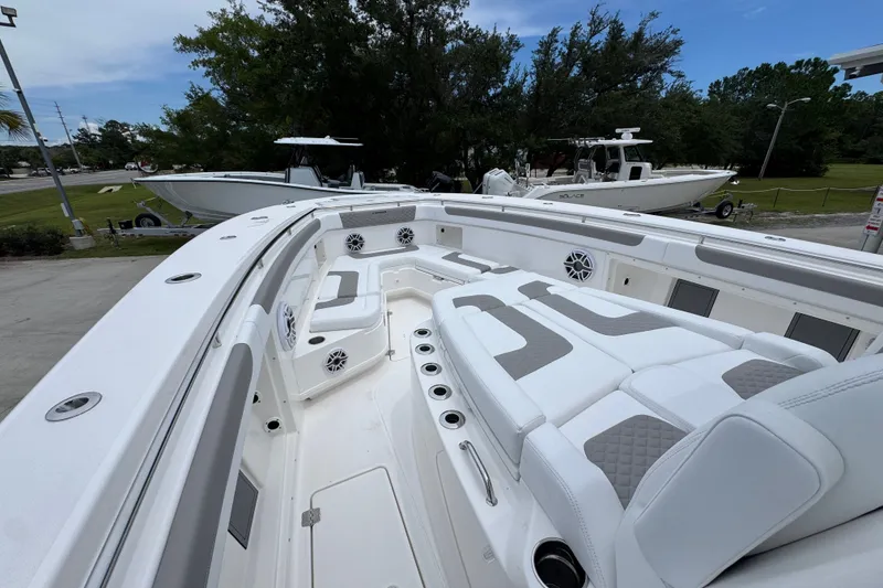 Slide: The Image of 2027 Caymas 401 DR boat interior with spacious seating and modern design. - 22