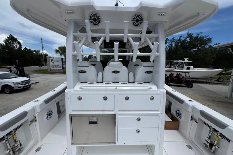 Slide: The Image of 2027 Caymas 401 DR boat interior with seating and storage compartments. - 48