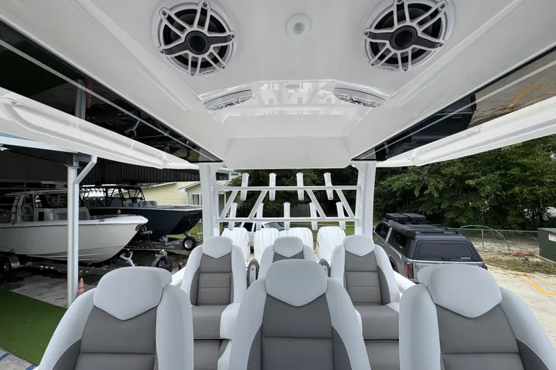 Slide: The Image of Interior view of 2027 Caymas 401 DR boat with modern seating and speakers. - 38