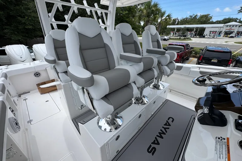 Slide: The Image of 2027 Caymas 401 DR boat interior with luxurious seating and modern helm controls. - 39