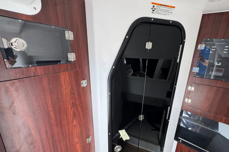 Slide: The Image of Interior of 2027 Caymas 401 DR boat with wood cabinetry and modern design. - 31