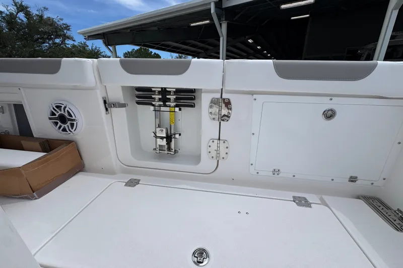 Slide: The Image of 2027 Caymas 401 DR boat interior with storage compartments and speaker. - 51
