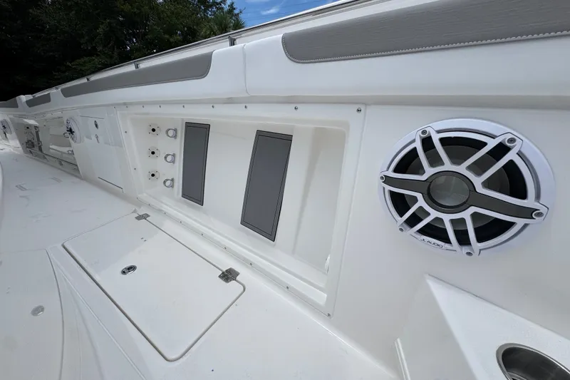 Slide: The Image of 2027 Caymas 401 DR boat interior with speaker and control panel. - 27