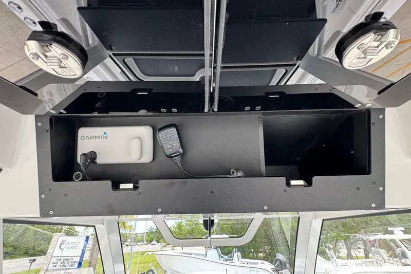 Slide: The Image of Storage compartment in a 2027 Caymas 401 DR boat with Garmin equipment. - 43