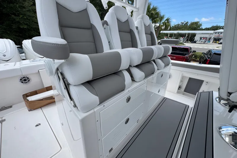 Slide: The Image of Luxury seating on 2027 Caymas 401 DR boat, featuring sleek gray and white upholstery. - 45