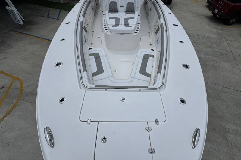 Slide: The Image of 2027 Caymas 401 DR boat with spacious seating and sleek design on display. - 23