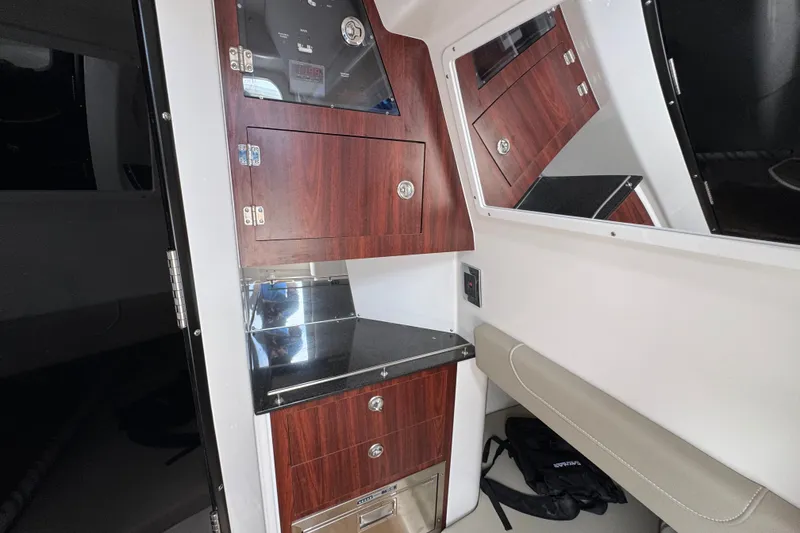 Slide: The Image of Interior of 2027 Caymas 401 DR boat with wood cabinetry and sleek design. - 32