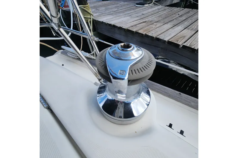 Slide: The Image of Winch on 1999 Beneteau Oceanis 411 Celebration sailboat, docked by wooden pier. - 13