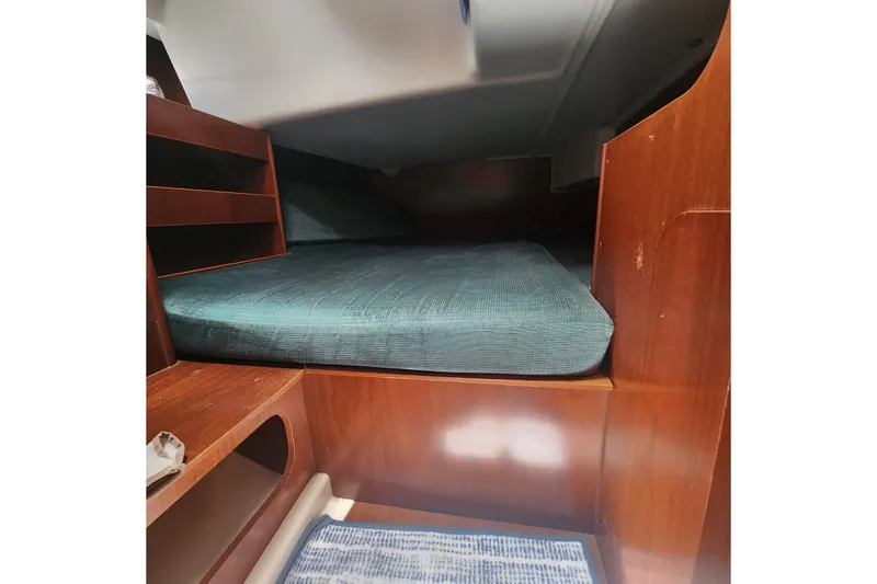 Slide: The Image of Cozy cabin interior of 1999 Beneteau Oceanis 411 Celebration sailboat with wooden finish. - 32