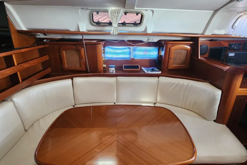 Slide: The Image of Interior of 1999 Beneteau Oceanis 411 Celebration yacht with elegant wood and leather seating. - 20