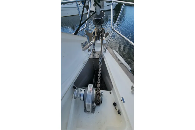 Slide: The Image of Anchor chain and windlass on 1999 Beneteau Oceanis 411 Celebration yacht deck. - 9