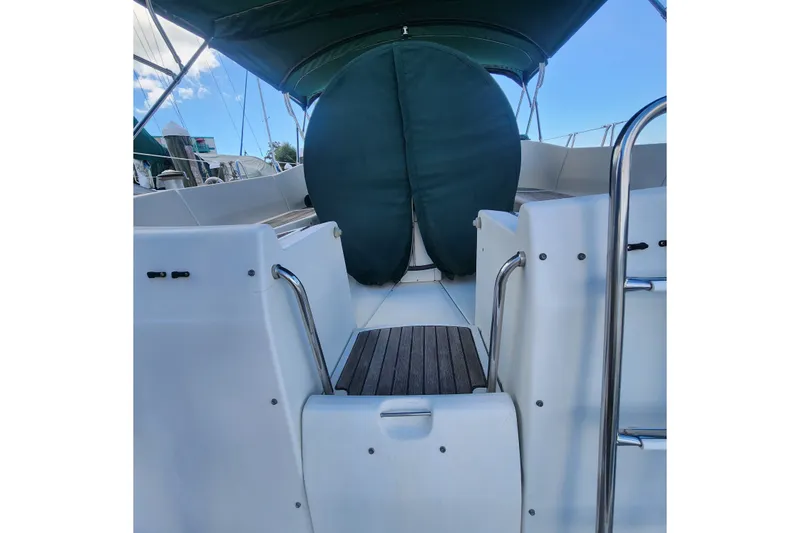 Slide: The Image of Cockpit view of 1999 Beneteau Oceanis 411 Celebration sailboat with green cover. - 8